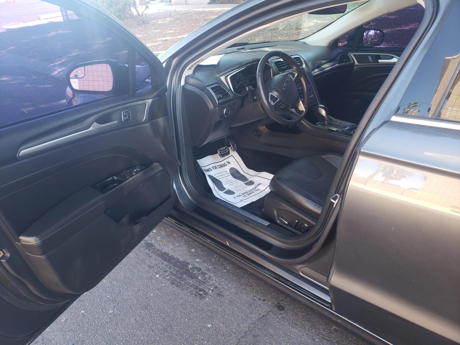 2016 /gray and black Ford Fusion titanium (3FA6P0K99GR) with an 2.0L L4 DOHC 16V engine, 4-Speed Automatic transmission, located at 323 E Dunlap Ave., Phoenix, AZ, 85020, (602) 331-9000, 33.567677, -112.069000 - 2016 Ford Fusion Titanium,......EXCELLENT condition, A Real Must See!!....ONLY 118K MILES,...... No accidents, Power everything, Touch screen Stereo/cd player, Phone sync, Bluetooth, Satellite compatible, Buckup camera, Navigation, Ice cold ac, Clean gray and Black interior with black leather seats - Photo #8